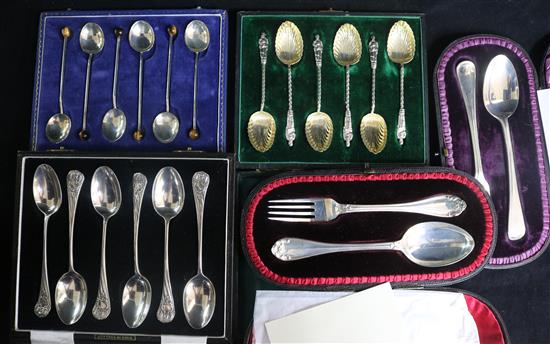 Three cased sets of six silver teaspoons including one with tigers eye quartz terminals and two cased christening sets.